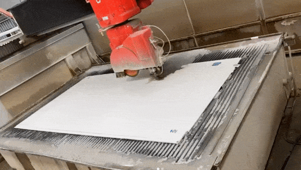 The Stone Shop water jet cutting a piece of stone slab.